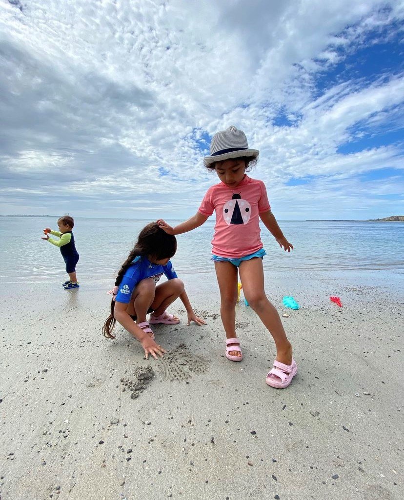 Audrey at beach with sister